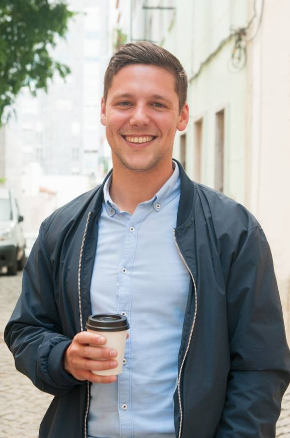 cheerful-guy-enjoying-outdoor-coffee-break_1262-20005.jpg